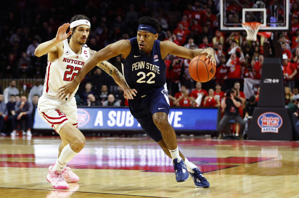 Penn State guard Jalen Pickett (22) drives to the basket against Rutgers guard Caleb McConnell (22) during the first half of an NCAA college basketball game in Piscataway, N.J. Tuesday, Jan. 24, 2023. (AP Photo/Noah K. Murray)