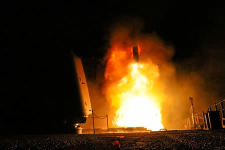 The U.S. Navy guided-missile cruiser USS Monterey fires a Tomahawk land attack missile April 14, 2018. U.S. Navy/Lt. j.g Matthew Daniels/Handout via REUTERS