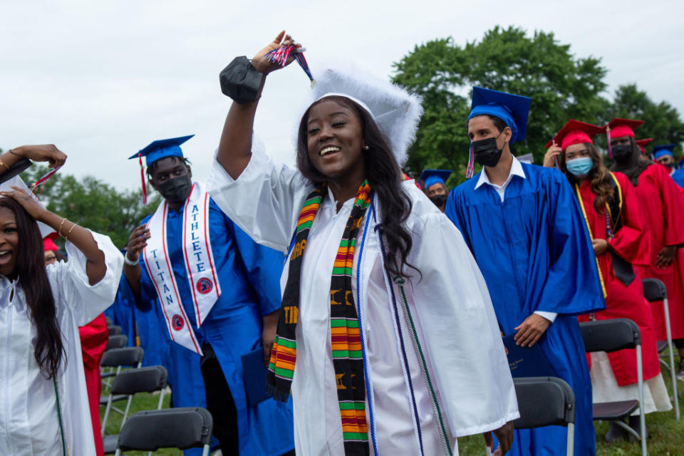 An African American girl graduate today