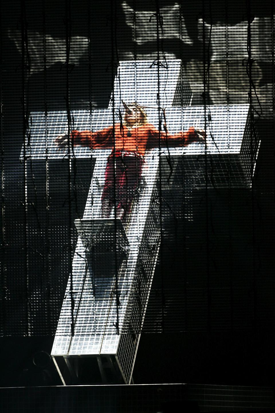 Help! A 50 year old woman is chained to a moving cross! Oh it's just Madonna