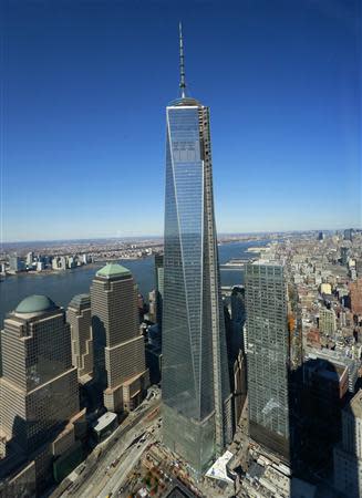 The One World Trade Center tower is seen from the 68th floor of the 4 World Trade Center tower in New York, November 13, 2013. REUTERS/Shannon Stapleton