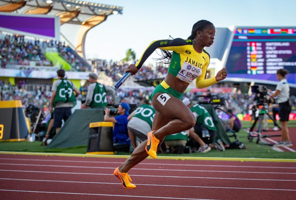 Jamaica’s Kemba Nelson takes off at the start of the women’s 4x100 meter relay at the World Athletics Championships Saturday, July 23, 2022 at Hayward Field in Eugene, Ore.