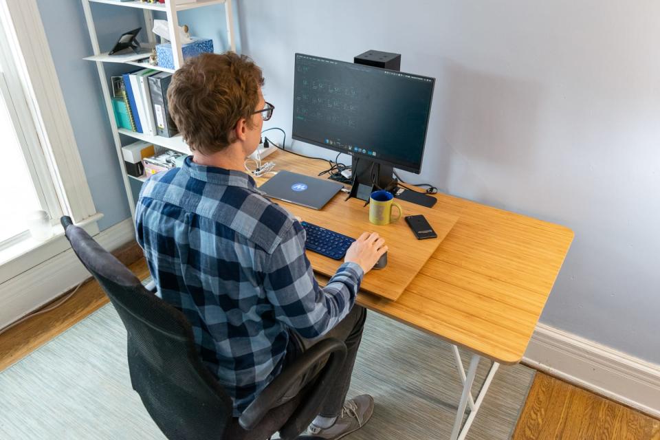 Standing desk converters