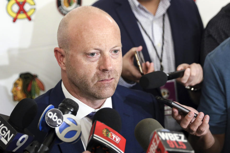 FILE- In this July 26, 2019, file photo, Chicago Blackhawks senior vice president and general manager Stan Bowman speaks to the media during the NHL hockey team's convention in Chicago. Bowman resigned Tuesday, Oct. 26, 2021, following an investigation into allegations that an assistant coach sexually assaulted a player in 2010. (AP Photo/Amr Alfiky, File)