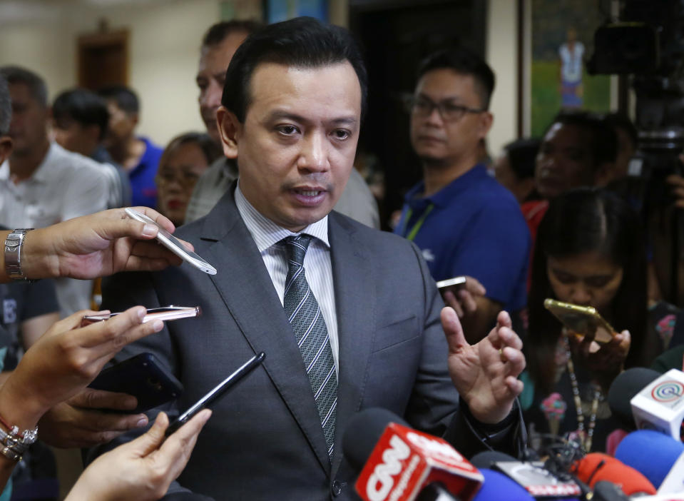 Philippine opposition Sen. Antonio Trillanes IV gestures as he talks to the media outside his office in the Philippine Senate after posting bail at a regional trial court following an arrest warrant issued Tuesday, Sept. 25, 2018 in suburban Pasay city, south of Manila, Philippines. Trillanes IV vowed to remain holed up in his office at the Senate until he is cleared of all the charges against him after President Rodrigo Duterte voided an amnesty given to the former rebel military officer. (AP Photo/Bullit Marquez)