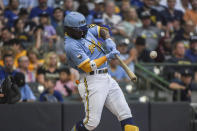 Milwaukee Brewers' Andrew McCutchen hits a single during the second inning of the team's baseball game against the Toronto Blue Jays on Friday, June 24, 2022, in Milwaukee. (AP Photo/Kenny Yoo)