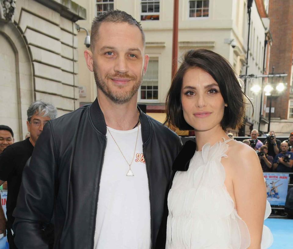 David M. Benett/Dave Benett/WireImage Tom Hardy and his wife Charlotte Riley attend the U.K. premiere of "Swimming With Men