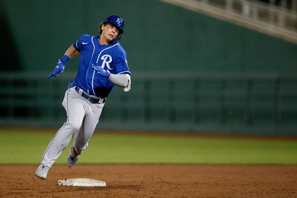 Kansas City Royals Bobby Witt Jr., rounds the bases on an error, inside the park home run, which was misplayed by Cincinnati Reds left fielder Errol Robinson in the eighth inning of the MLB Cactus League Spring Training game between the Cincinnati Reds and the Kansas City Royals at Goodyear Ballpark in Goodyear, Ariz., on Thursday, March 4, 2021. The Royals won 5-3 in a nine-inning game.
(Photo: Sam Greene)