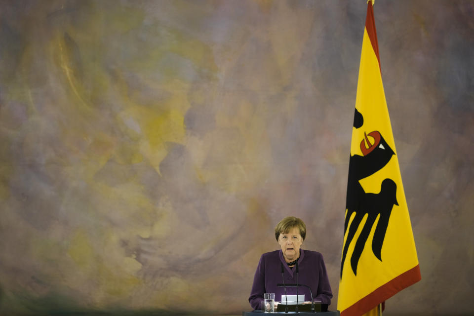 Former German Chancellor Angela Merkel speaks after she received the Grand Cross of the Order of Merit of the Federal Republic of Germany in a special design from German President Frank-Walter Steinmeier, during a reception at Bellevue Palace in Berlin, Germany, Monday, April 17, 2023. (AP Photo/Markus Schreiber)