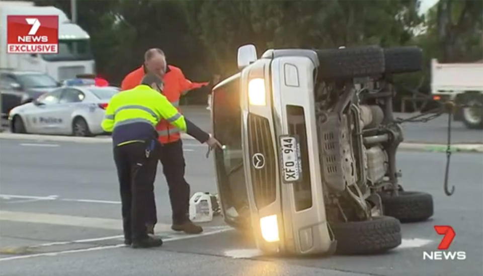 Aaron swerved and rolled his car onto its side, only just missing the prime mover. Source: 7 News