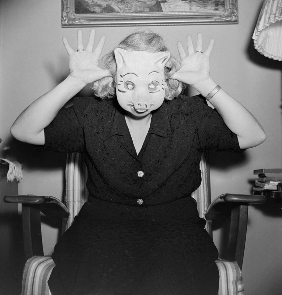 A woman in a pig mask