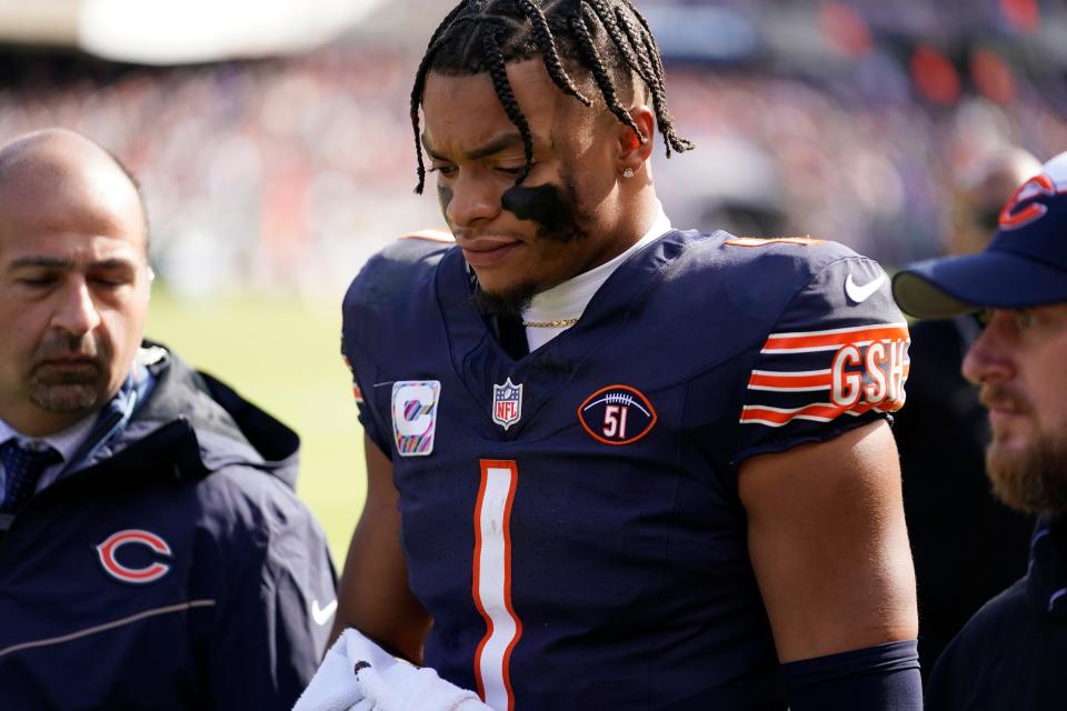 Chicago Bears quarterback Justin Fields walks to the locker room after being sacked during the second half of an NFL football game against the Minnesota Vikings, Sunday, Oct. 15, 2023, in Chicago.