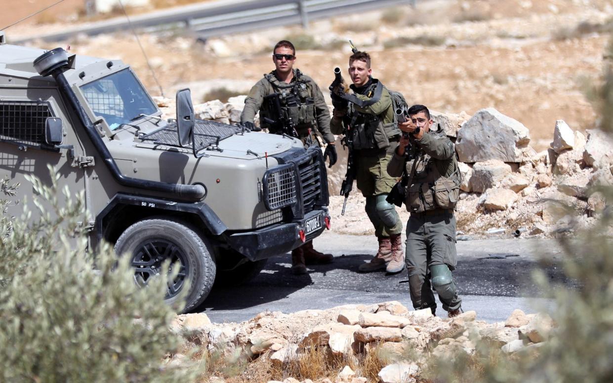 Israeli soldiers fire tear gas canisters on protesters near Hebron - Abed Al Hashlamoun/EPA-EFE/Shutterstock