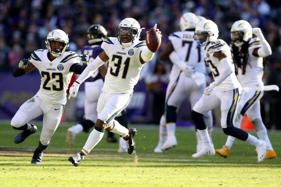 <p>Adrian Phillips #31 of the Los Angeles Chargers celebrates after intercepting a pass by Lamar Jackson #8 of the Baltimore Ravens during the second quarter in the AFC Wild Card Playoff game at M&T Bank Stadium on January 06, 2019 in Baltimore, Maryland. (Photo by Rob Carr/Getty Images) </p>