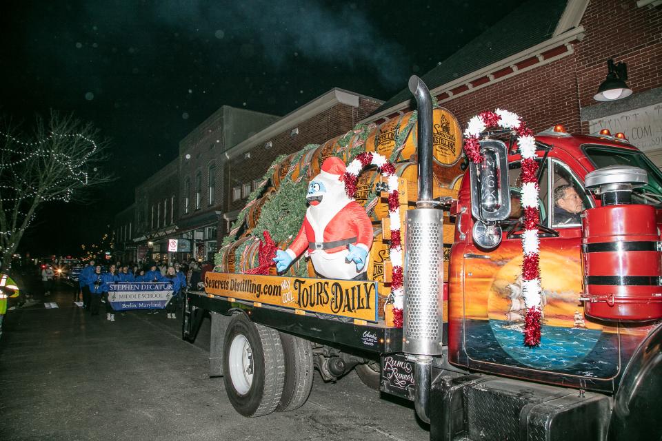 A Seacrets Distilling truck and the Stephen Decatur Middle School band take part in the Berlin Christmas Parade on Thursday, Dec. 1, 2022.