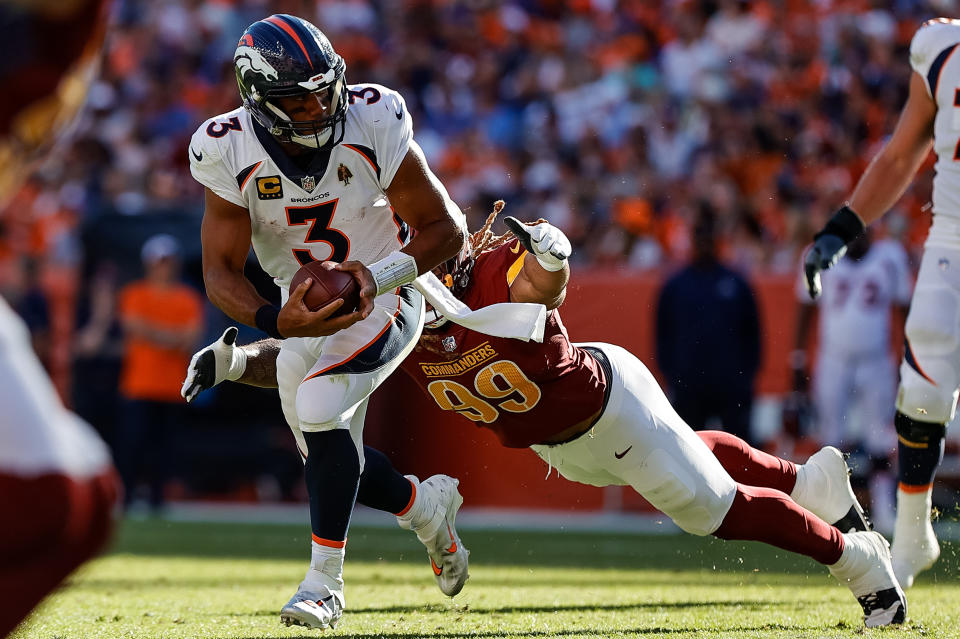 Denver Broncos quarterback <a class="link " href="https://sports.yahoo.com/nfl/players/25785" data-i13n="sec:content-canvas;subsec:anchor_text;elm:context_link" data-ylk="slk:Russell Wilson;sec:content-canvas;subsec:anchor_text;elm:context_link;itc:0">Russell Wilson</a> (3) is sacked by Washington Commanders defensive end <a class="link " href="https://sports.yahoo.com/nfl/players/32672" data-i13n="sec:content-canvas;subsec:anchor_text;elm:context_link" data-ylk="slk:Chase Young;sec:content-canvas;subsec:anchor_text;elm:context_link;itc:0">Chase Young</a> (99). Mandatory Credit: Isaiah J. Downing-USA TODAY Sports