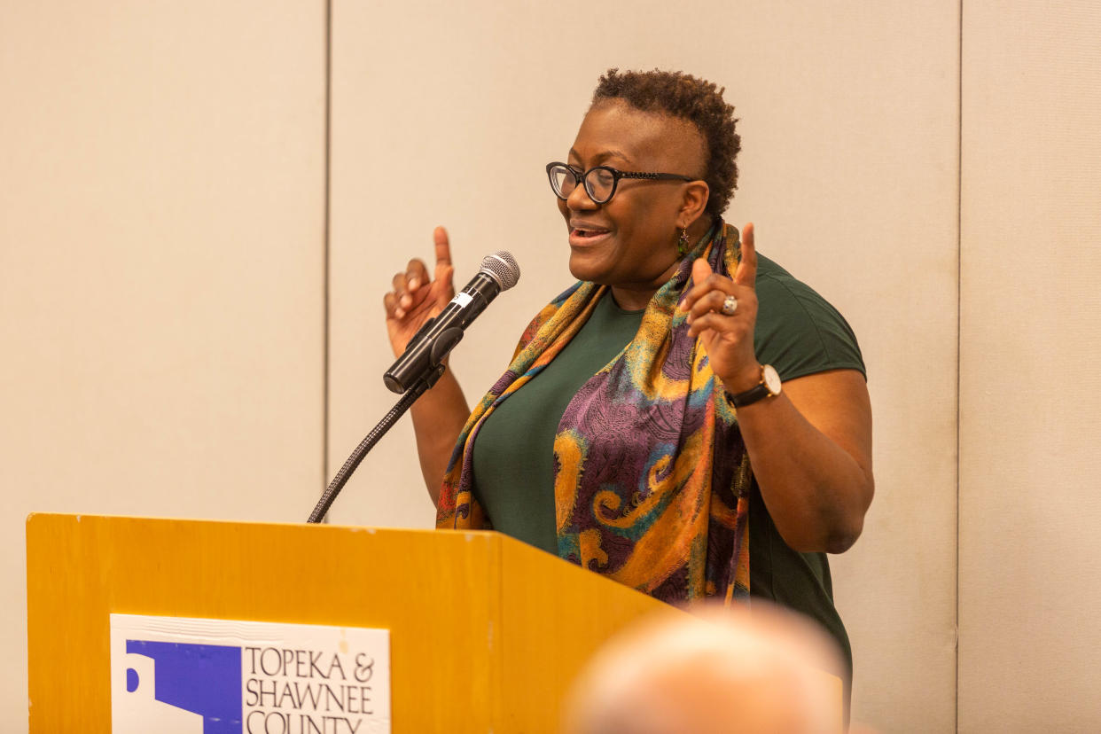 Wanda Holland Green, a member of the Columbia University Board of Trustees and head of school at the Hamlin School in San Francisco, opens up a speech to Topeka-area business leaders with song.