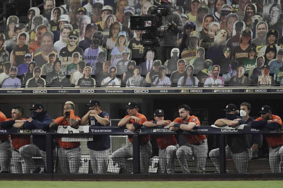 Houston Astros watch the eighth inning in Game 7 of a baseball American League Championship Series against the Tampa Bay Rays, Saturday, Oct. 17, 2020, in San Diego. (AP Photo/Jae C. Hong)