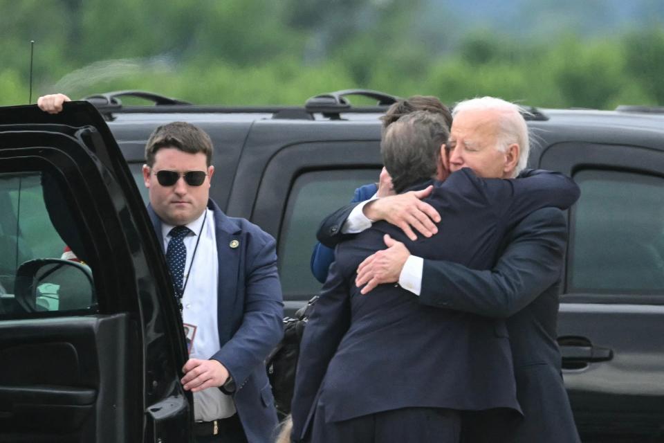 US President Joe Biden hugs his son Hunter Biden upon arrival at Delaware Air National Guard Base in New Castle, Delaware, on June 11, 2024 (AFP via Getty Images)