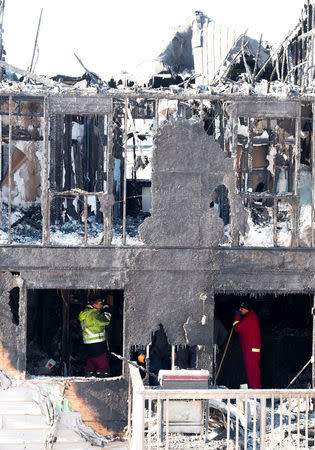 Police and fire invetsigators are on the scene of a fatal house fire in the community of Spryfield in Halifax, Nova Scotia, Canada, February 19, 2019. REUTERS/Ted Pritchard