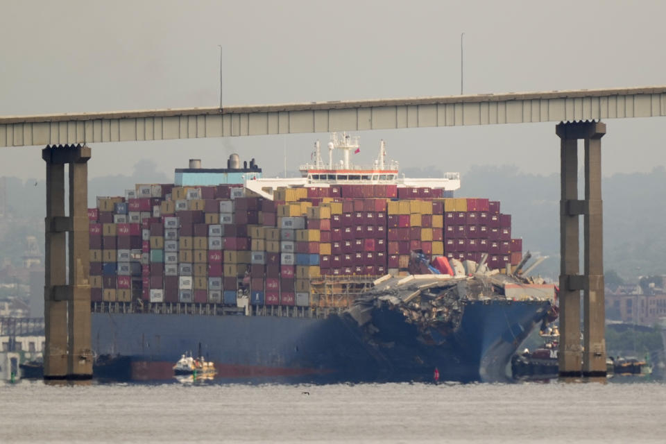 Tugboats escort the cargo ship Dali after it was refloated in Baltimore, Monday, May 20, 2024. The container ship that caused the deadly collapse of Baltimore's Francis Scott Key Bridge was refloated Monday and has begun slowly moving back to port. (AP Photo/Matt Rourke)