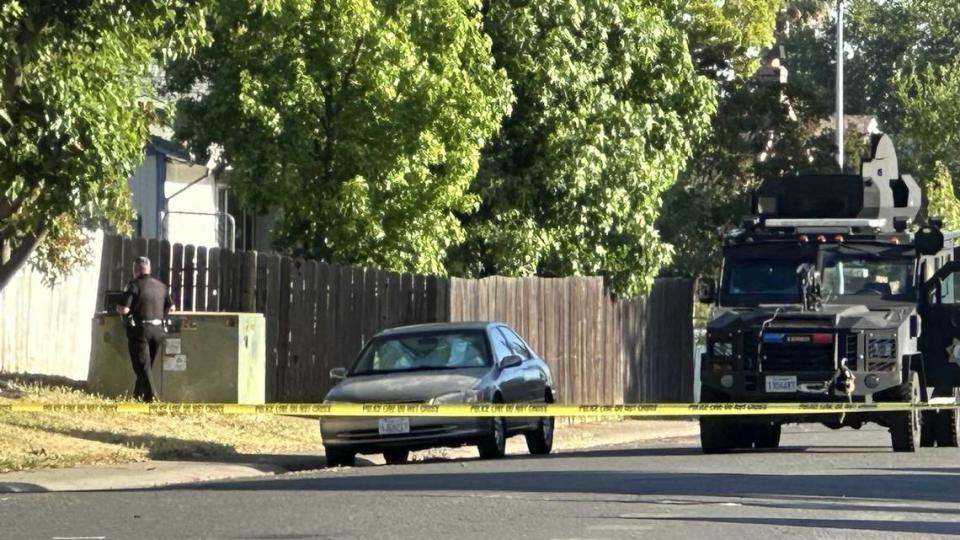 A Sacramento County sheriff’s deputy canvasses the 3300 block of Hartselle Way for evidence after a deputy-involved shooting killed a man early Thursday. The man is also suspected of gunning down two people during an hourslong standoff in Rancho Cordova.