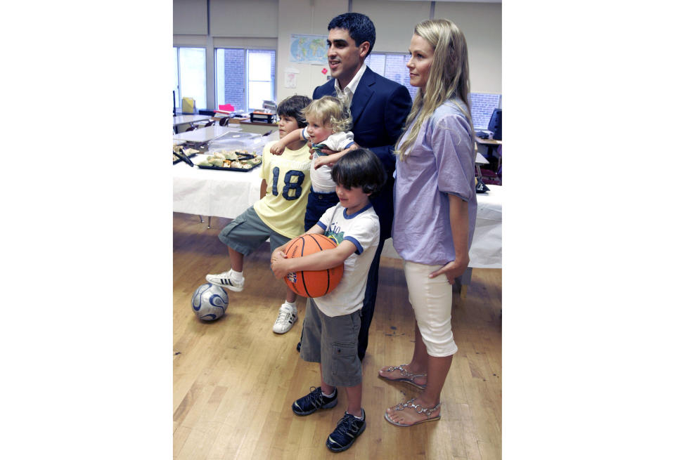 FILE - New York Red Bulls midfielder Claudio Reyna, top center, and his wife, Danielle, right, pose with their sons, Jack, 9, Joah, 17 months, and Giovanni, 5, from left, before a news conference in Newark, N.J., July 16, 2008, to announce Reyna's retirement from soccer. The U.S. men's soccer team was plunged into public turmoil Wednesday, Jan. 4, 2023, when the Reyna family said it notified the U.S. Soccer Federation of a decades-old incident involving Gregg Berhalter and his wife in response to the coach’s disparagement of young star Gio Reyna. (AP Photo/Mike Derer, File)