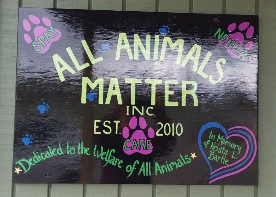 The sign for All Animals Matter. The organization raises funds to help cats get spayed or neutered.