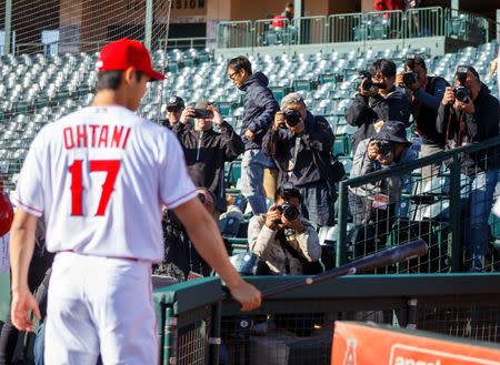 Feb 22, 2018; Tempe, AZ, USA; Members of the media photograph Los Angeles Angels pitcher Shohei Ohtani during media day at Tempe Diablo Stadium. Mandatory Credit: Mark J. Rebilas-USA TODAY Sports