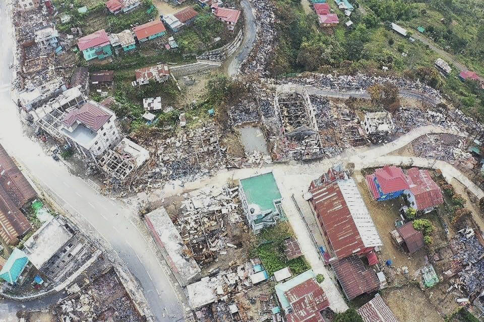 In this aerial photo released by the Chin Human Rights Organization, buildings destroyed by fire fill the town of Thantlang in Chin State in northwest Myanmar, Dec. 4, 2021. More than 580 buildings have been burned since September, according to satellite image analysis by Maxar Technologies. (Chin Human Rights Organization via AP)