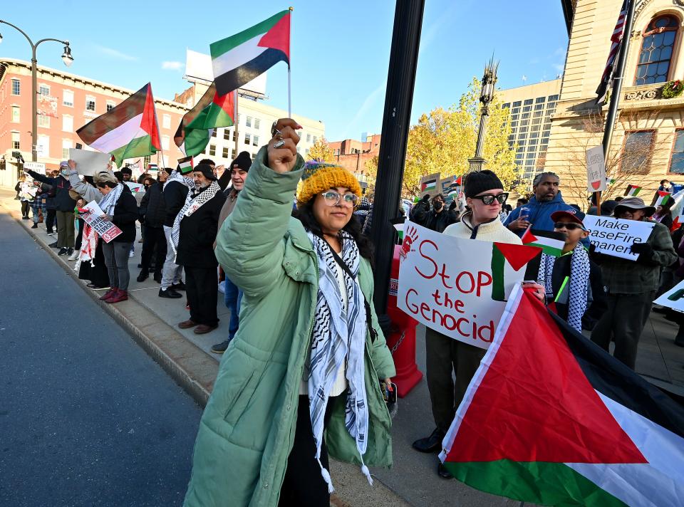 Zaina Mahmoud of the Worcester Solidarity Coalition helps lead a Free Palestine rally at City Hall Friday afternoon.