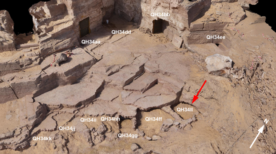 The tomb area at Qubbat al-Hawā. A red arrow points to the tomb where the crocodile mummies were found.