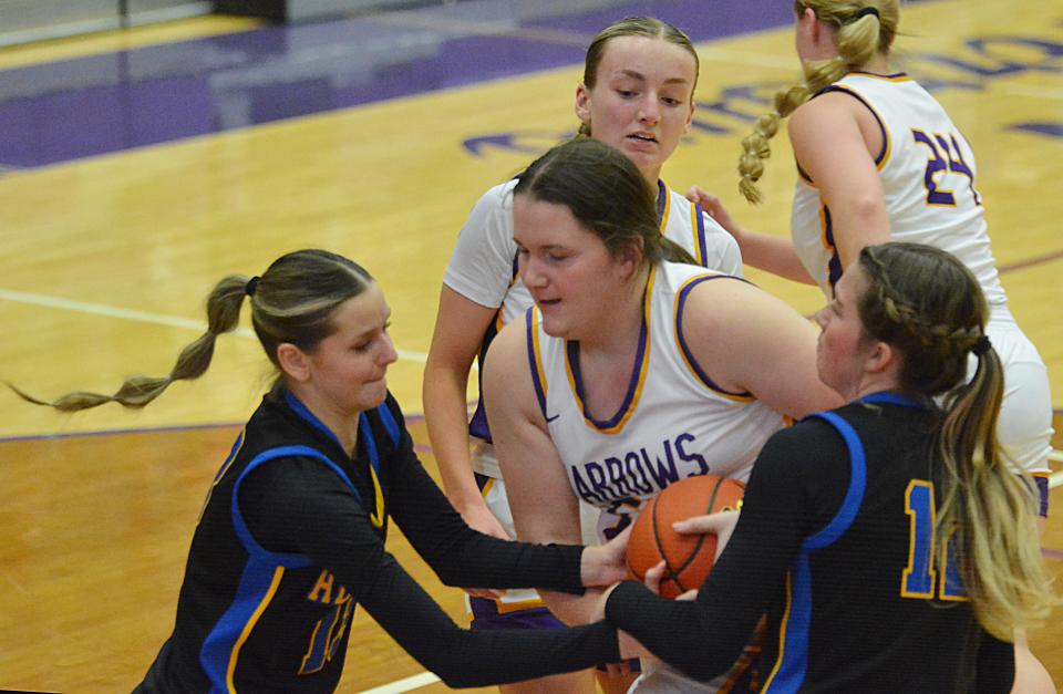 Aberdeen Central's Emma Dohrer (left) and Kenadi Withers try to tie up Watertown's Malia Kranz during their high school girls basketball game on Tuesday, Jan. 9, 2024 in the Watertown Civic Arena. Aberdeen Central won 41-35.