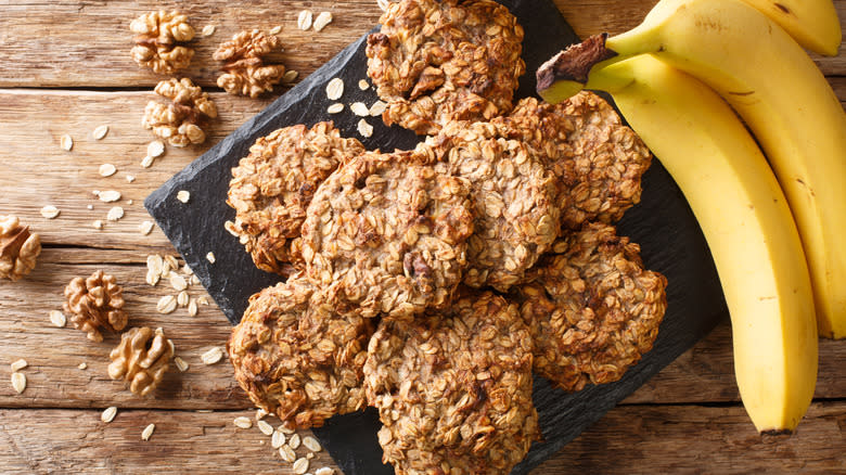 vegan cookies on plate with walnuts and bananas