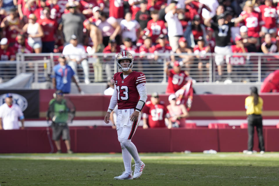 San Francisco 49ers quarterback Brock Purdy (13) walks toward the sideline during the second half of an NFL football game against the Arizona Cardinals in Santa Clara, Calif., Sunday, Oct. 6, 2024. (AP Photo/Godofredo A. Vásquez)