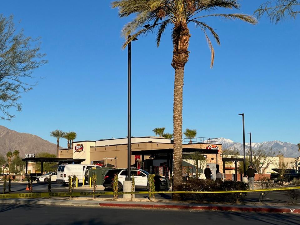 Police officers investigate a suspected homicide in the 5600 block of Ramon Road near Raising Cane's restaurant on Jan. 11.