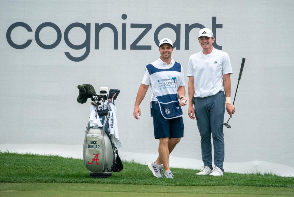 Golfer Nick Dunlap laughs with his caddie Hunter Hamrick on the ninth hole during Friday's second round of the Cognizant Classic in the Palm Beaches at PGA National in Palm Beach Gardens.