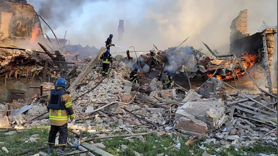 This handout photograph released by Ukrainian State Emergency Service on May, 8, 2022, show Ukrainian firefighters putting out a fire after Russian missiles hit a school in eastern Ukraine's Lugansk region on May, 7, 2022. - Sixty civilians died in the bombing of a school in eastern Ukraine's Lugansk region this weekend, President Volodymyr Zelensky said on May, 8, 2022. "Just yesterday in the village of Bilogorivka, Lugansk region, a Russian bomb killed 60 people. Civilians," Zelensky said during an address to the G7 summit by video conference. (Photo by Handout / Ukrainian State Emergency Service / AFP) / RESTRICTED TO EDITORIAL USE - MANDATORY CREDIT "AFP PHOTO / Ukrainian State Emergency Service" - NO MARKETING NO ADVERTISING CAMPAIGNS - DISTRIBUTED AS A SERVICE TO CLIENTS (Photo by HANDOUT/Ukrainian State Emergency Servic/AFP via Getty Images)