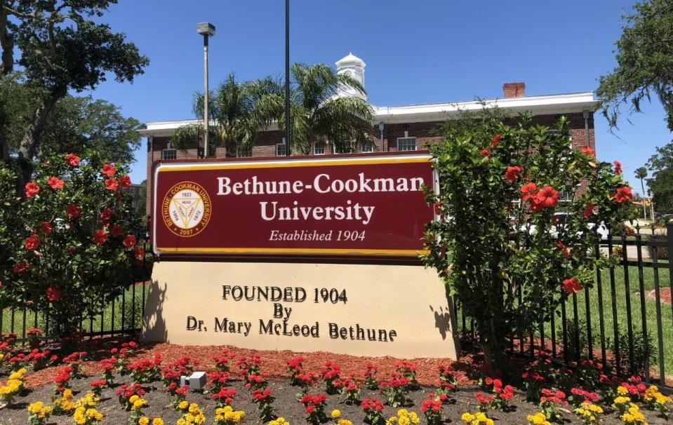 A Bethune-Cookman University sign stands in front of White Hall on the Daytona Beach campus.