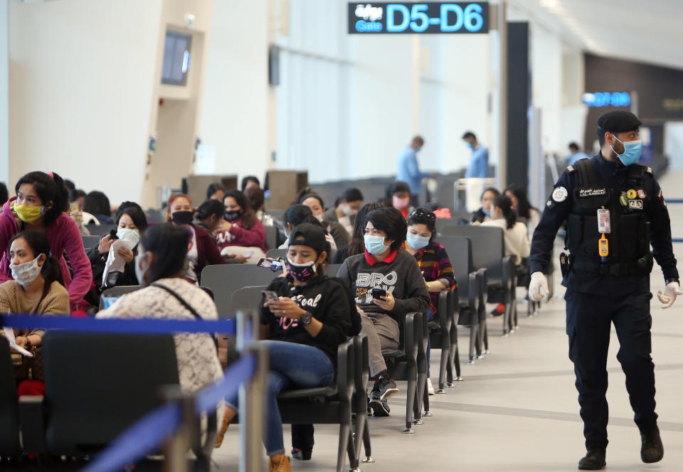 FILE PHOTO: Filipinos who availed general amnesty granted by the Kuwaiti government are pictured gathering at the Kuwait International Airport Terminal 4, on April 3, 2020 on their home to Manila amid the coronavirus COVID-19 pandemic crisis. (Photo: YASSER AL-ZAYYAT/AFP via Getty Images)