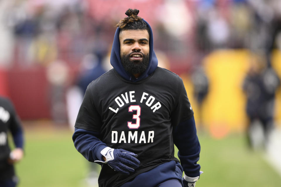 Dallas Cowboys running back Ezekiel Elliott (21) wearing a t-shirt with message for Buffalo Bills safety Damar Hamlin before the start of an NFL football game against the Washington Commanders, Sunday, Jan. 8, 2023, in Landover, Md. (AP Photo/Nick Wass)