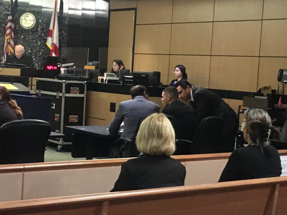 Jullian Cathirell consults with his attorneys before the verdict is read his murder trial. He was found guilty of second-degree murder and first-degree murder in the March 2017 deaths of twins Brian and Brandon Allen.