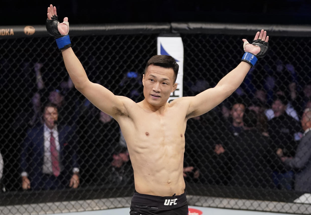 BUSAN, SOUTH KOREA - DECEMBER 21: Chan Sung Jung of South Korea celebrates after knocking out Frankie Edgar in their featherweight fight during the UFC Fight Night event at Sajik Arena 3 on December 21, 2019 in Busan, South Korea. (Photo by Jeff Bottari/Zuffa LLC via Getty Images)