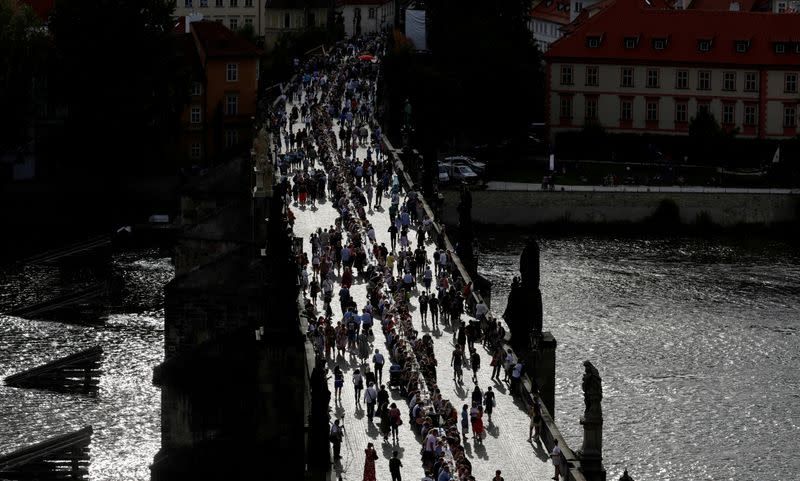 Residents dine at the medieval Charles Bridge in Prague