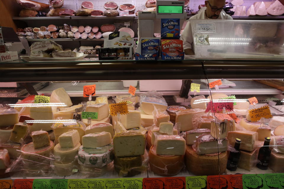 Blocks of Italian cheese are on sale in a deli in Rome, Thursday, Oct. 3, 2019. The U.S. had prepared for Wednesday's ruling and already drawn up lists of the dozens of goods it would put tariffs on. They include EU cheeses, olives, and whiskey, as well as planes, helicopters and aircraft parts in the case _ though the decision is likely to require fine-tuning of that list if the Trump administration agrees to go for the tariffs. (AP Photo/Alessandra Tarantino)