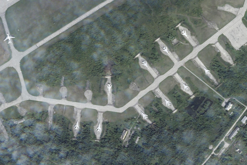 In this satellite photo from Planet Labs PBC, Tupolev Tu-22M bombers sit on the apron of the Soltsy air base in the Novgorod region of northwestern Russia on Wednesday, Aug. 16, 2023. Ukrainian saboteurs coordinated by Kyiv's military intelligence services carried out a pair of recent drone attacks that hit parked bomber aircraft at air bases deep inside Russia, Ukraine media claimed Tuesday, Aug. 22, 2023. One of those bases was Soltsy, where the bombers had later left, leaving a black spot where one had been earlier parked. (Planet Labs PBC via AP)