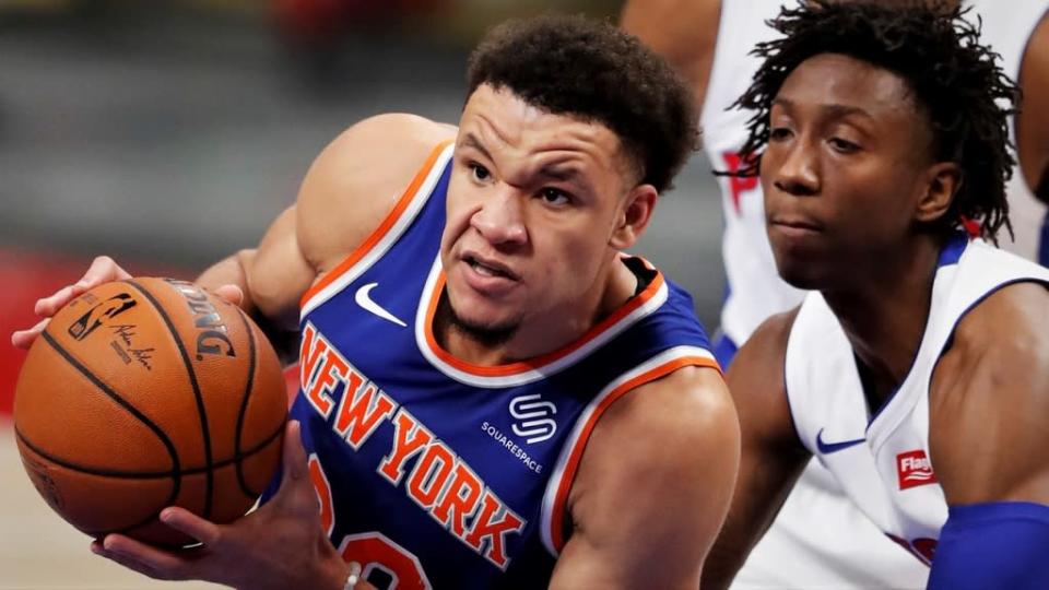 Dec 11, 2020; Detroit, Michigan, USA; New York Knicks forward Kevin Knox II (20) drives to the basket against Detroit Pistons guard Saben Lee (38) during the fourth quarter at Little Caesars Arena. Mandatory Credit: Raj Mehta-USA TODAY Sports