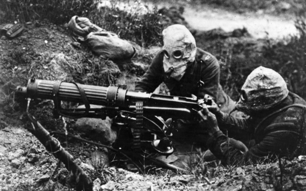 Gas-masked men of the British Machine Gun Corps with a Vickers machine gun during the first battle of the Somme.  - Getty Images