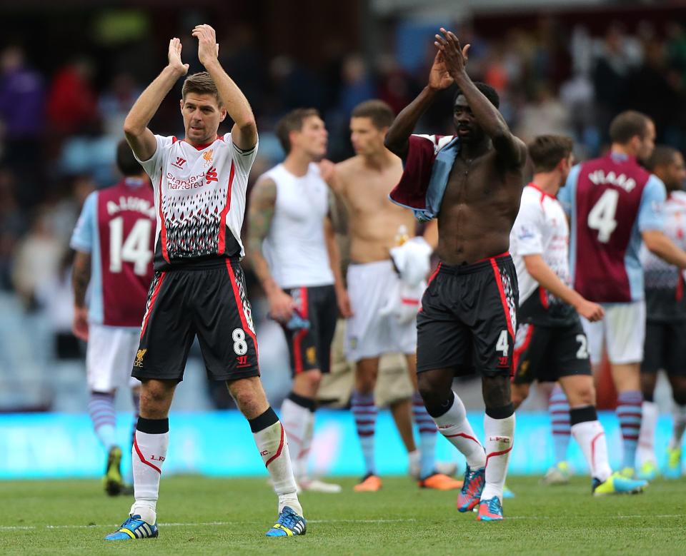 Liverpool's Steven Gerrard (left) and Kolo Toure (right) celebrate after the final whistle