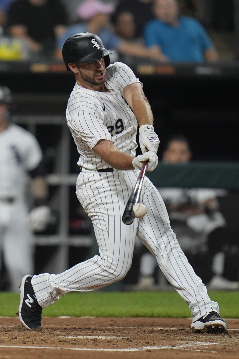 Chicago White Sox's Paul DeJong hits a single during the second inning of a baseball game against the Colorado Rockies, Friday, June 28, 2024, in Chicago. (AP Photo/Erin Hooley)